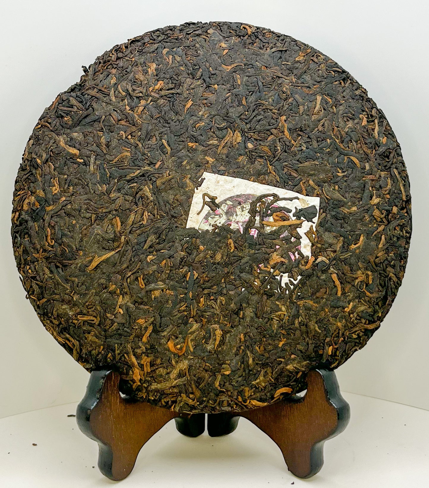 Endless Tea, Shu Pu-erh Bing, displayed out of rice paper wrapping