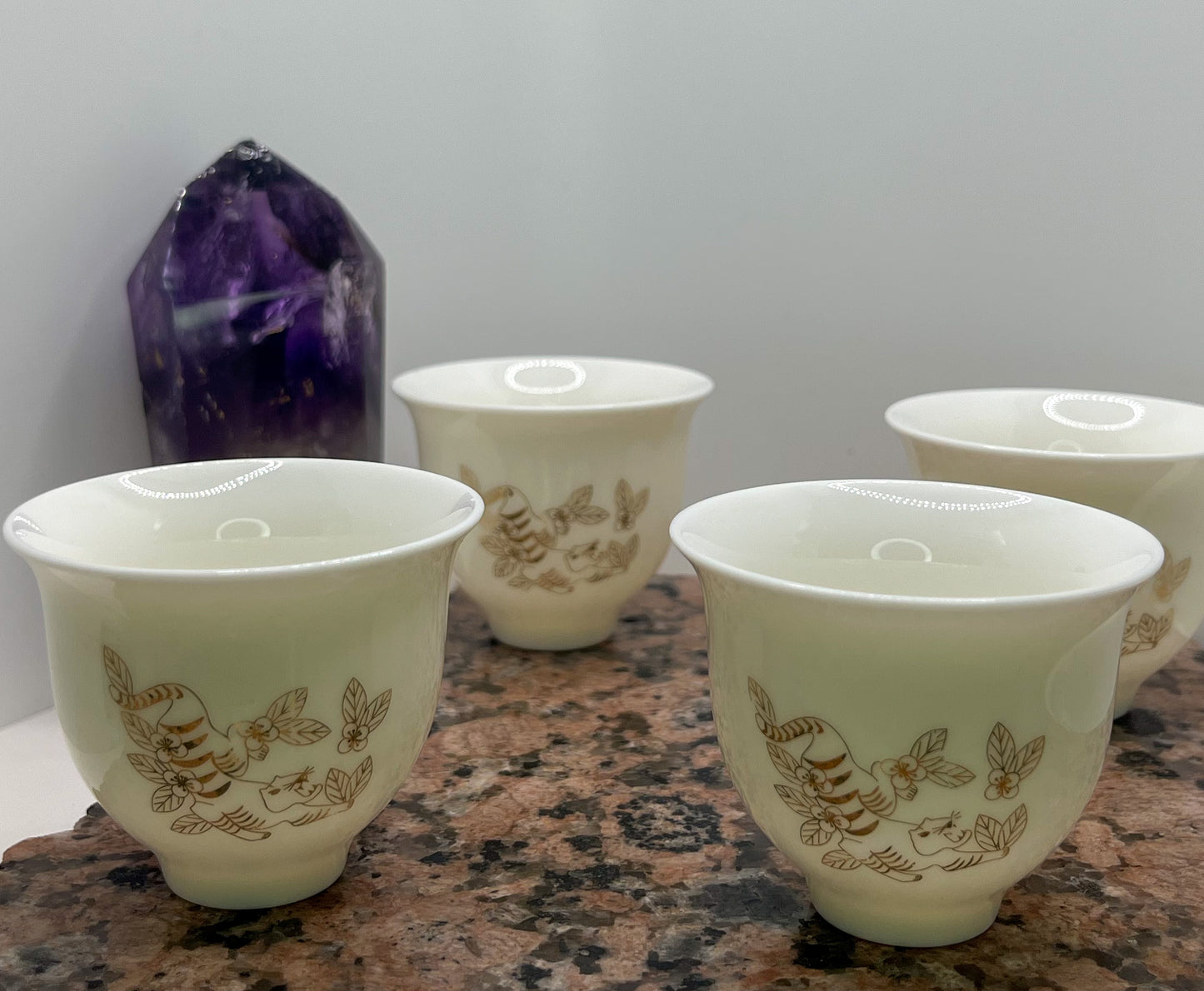 Set of four 50ml Crouching Tiger Tea Cups all facing forward to display design